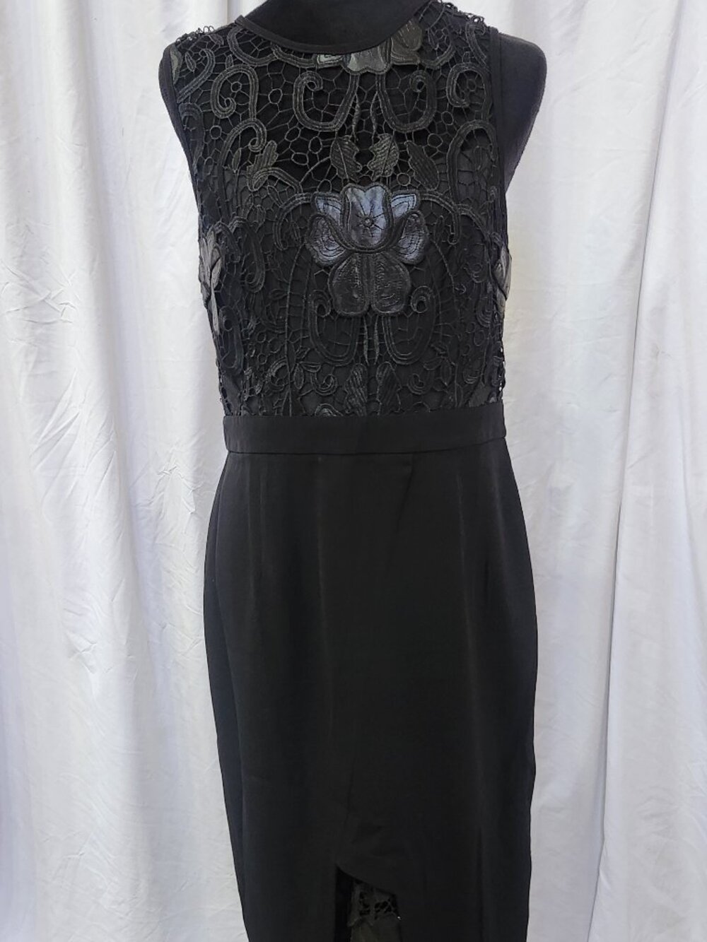 Black sleeveless lace cutout dress with slit, floral leather look detail, L